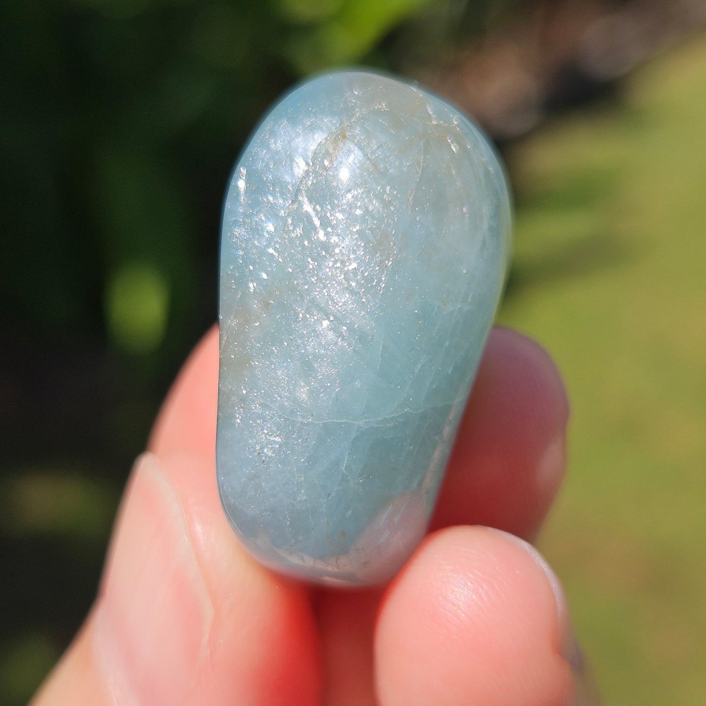 Aquamarine tumble with chatoyant sheen