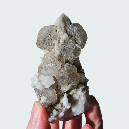 Stepped fluorite over white quartz point from Inner Mongolia