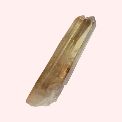 A smoky double-pointed citrine wand with a natural, unpolished surface.