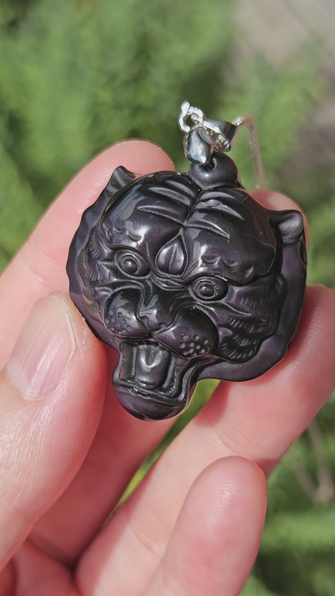Video of rainbow obsidian tiger pendant