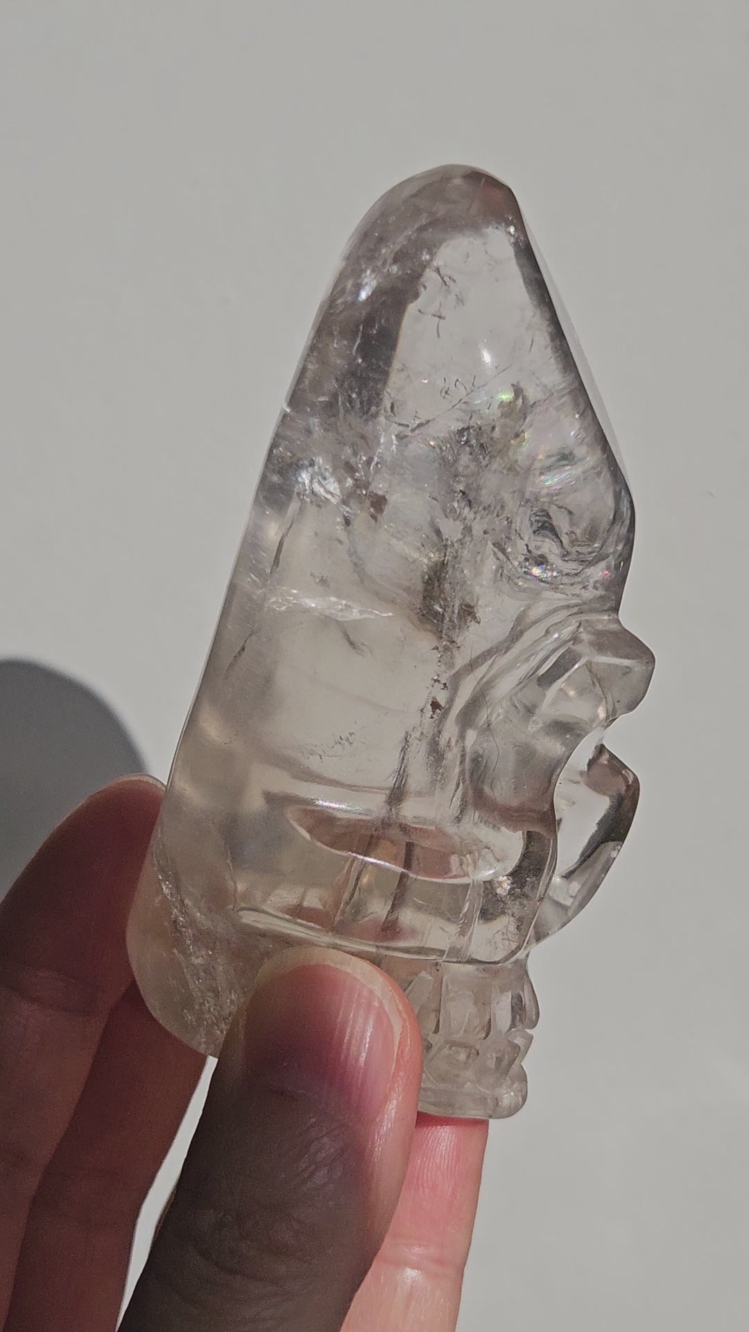 Video of smoky quartz crystal skull with rainbow reflections